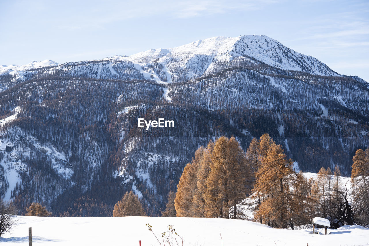 Snow covered mountain against sky