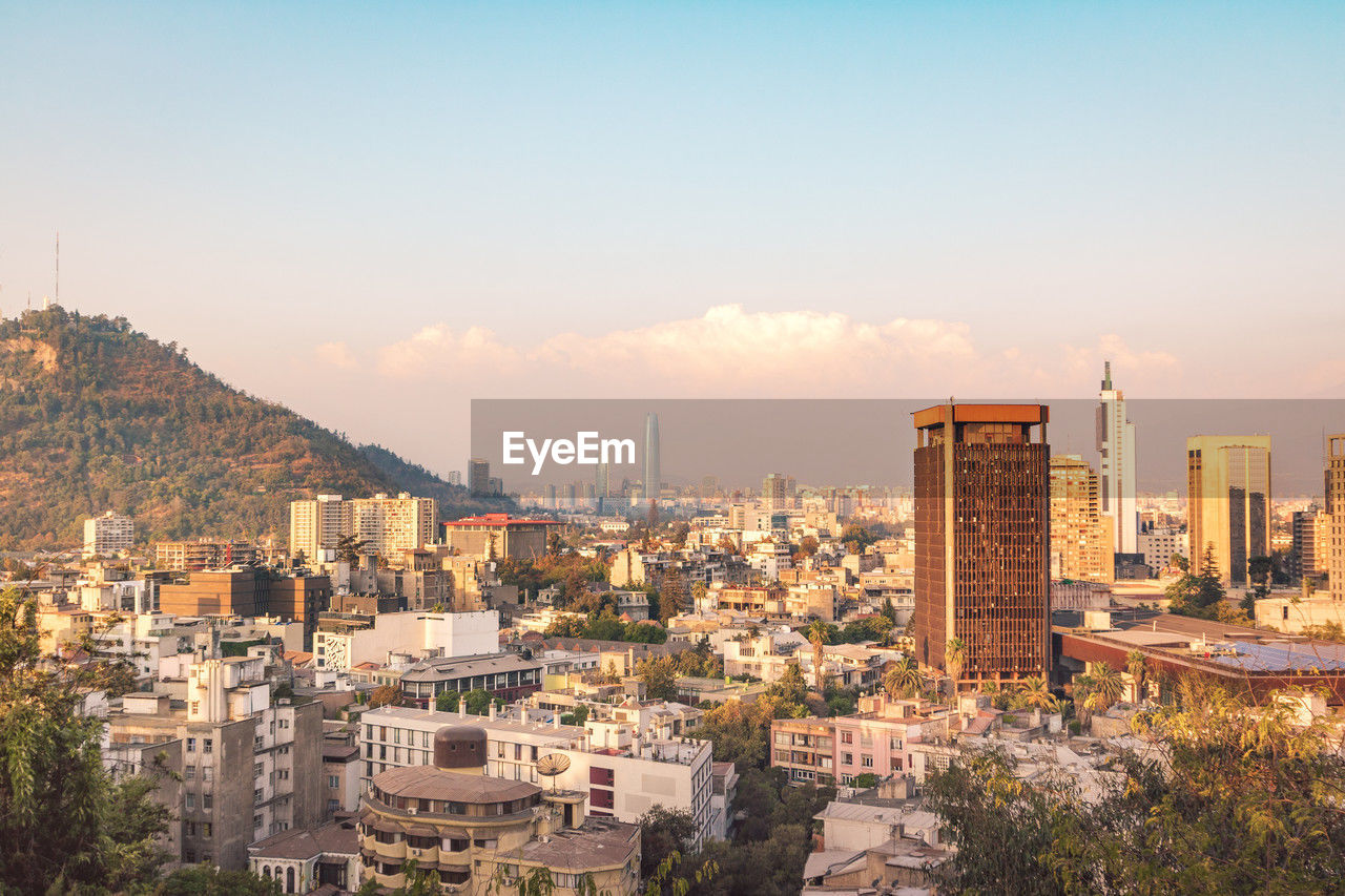 high angle view of cityscape against clear sky during sunset