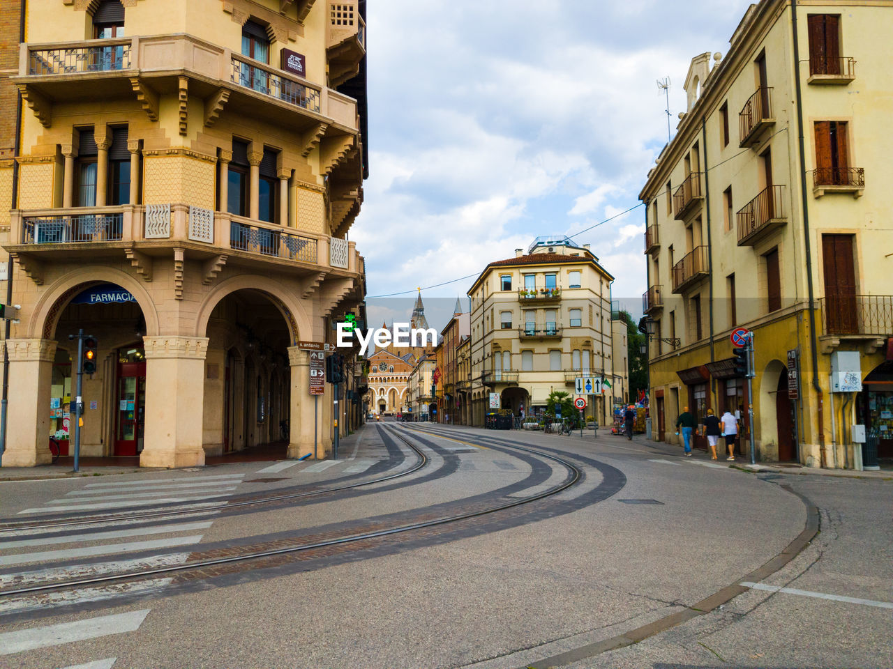 SURFACE LEVEL OF ROAD AMIDST BUILDINGS IN CITY