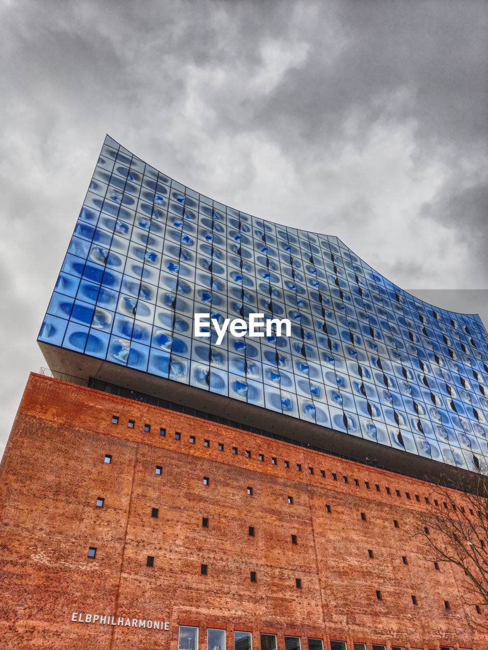 LOW ANGLE VIEW OF BLUE BUILDING AGAINST SKY