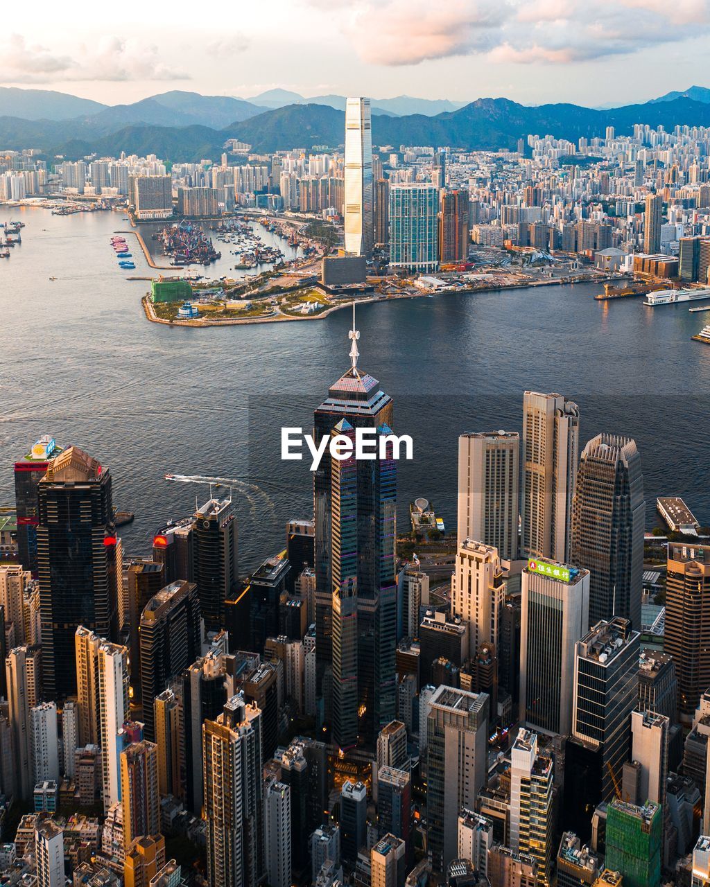 High angle view of buildings by sea against sky