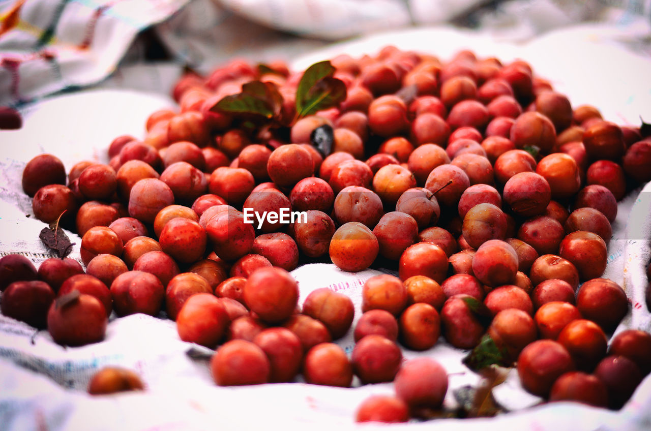 Plums for sale at market stall