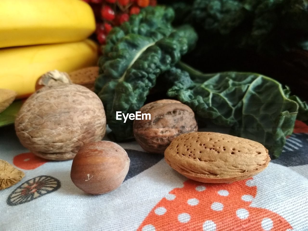 CLOSE-UP OF BREAD AND VEGETABLES ON TABLE