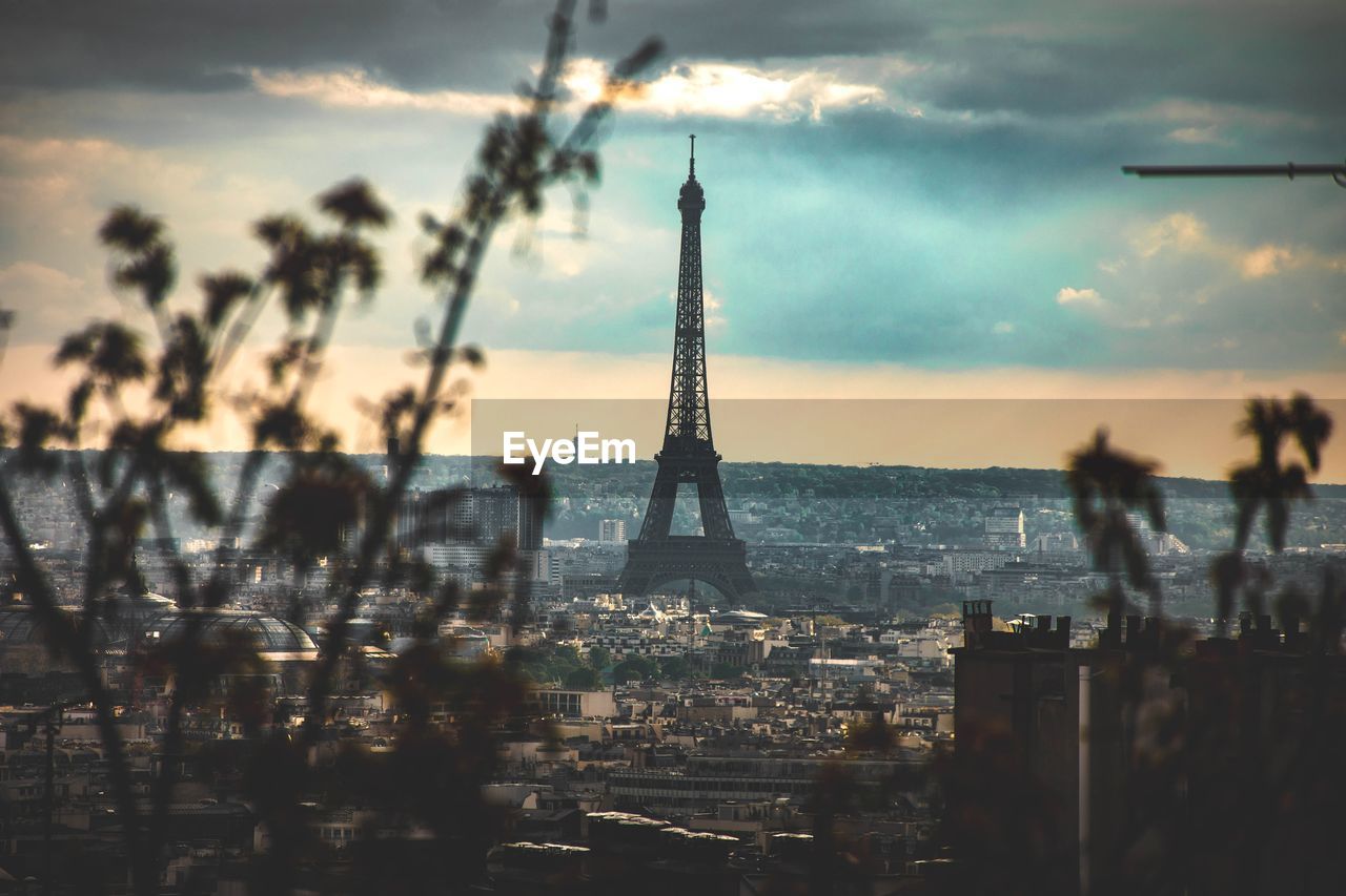 View of paris and the effeil tower against cloudy sky