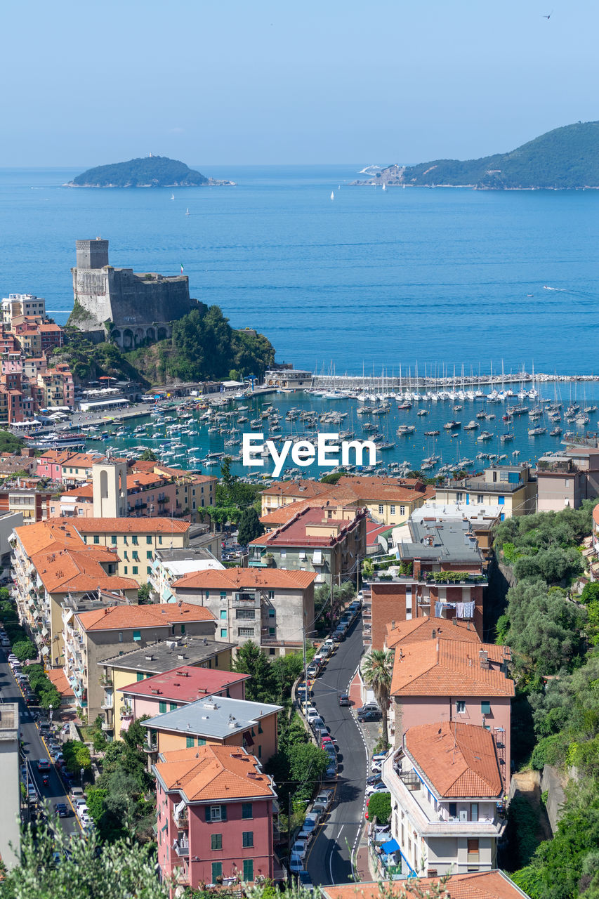 high angle view of townscape by sea