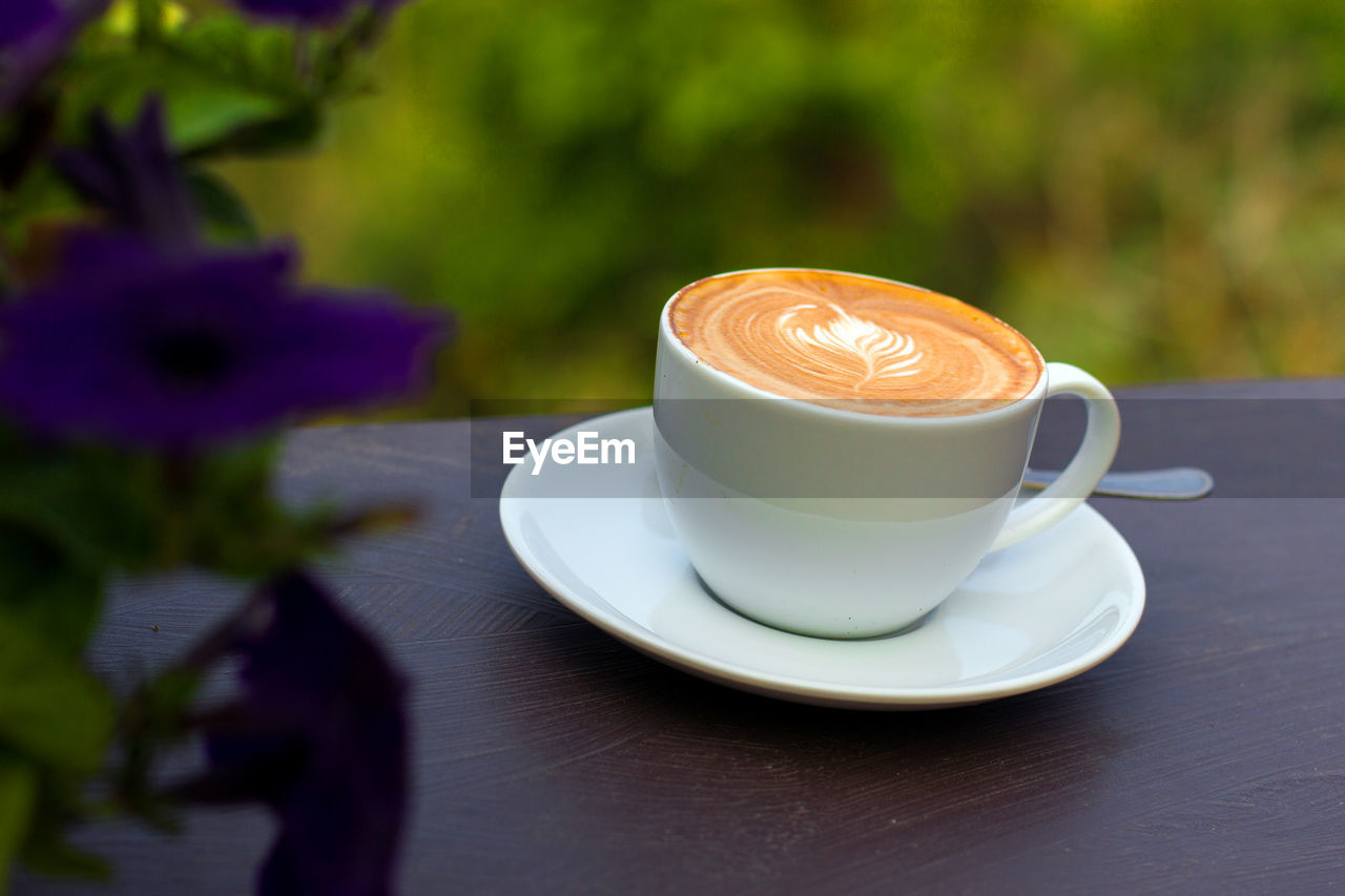 CLOSE-UP OF COFFEE ON TABLE