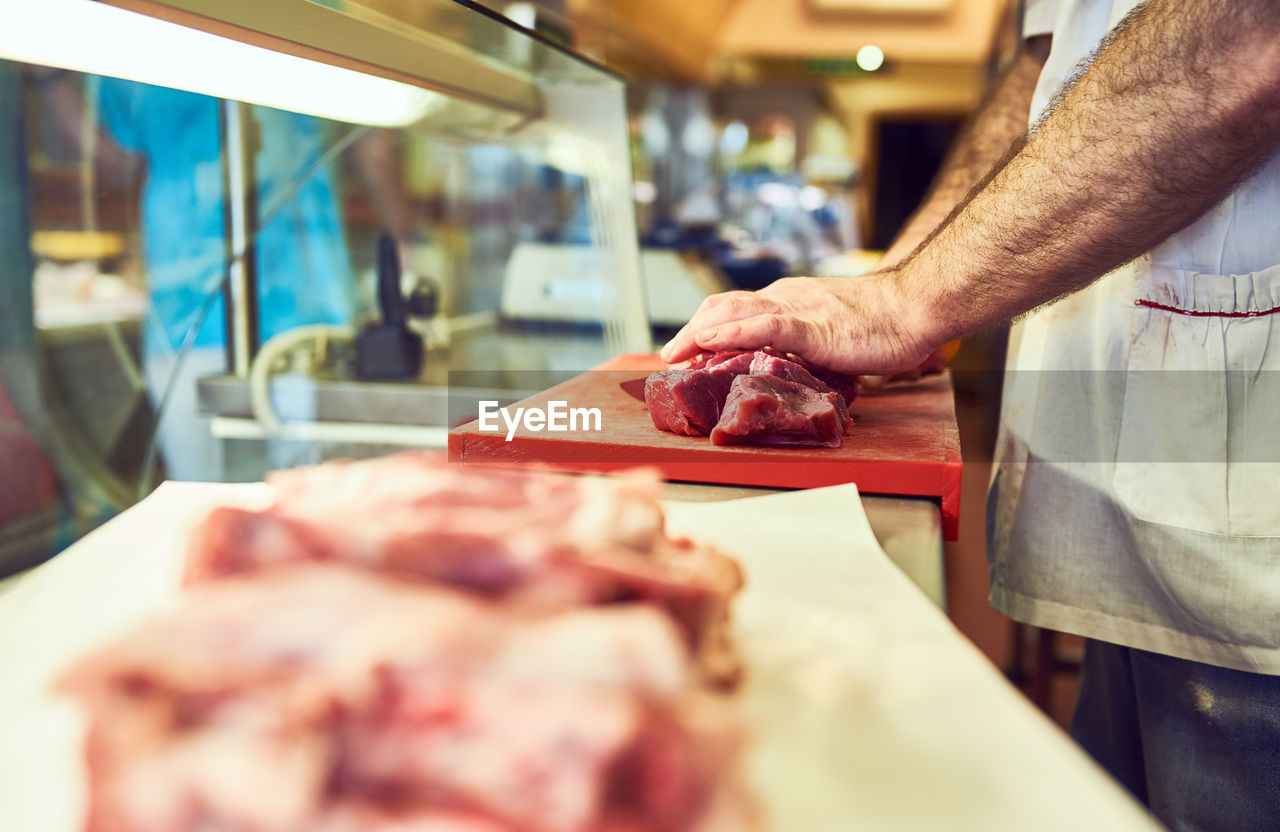 midsection of man preparing food on table