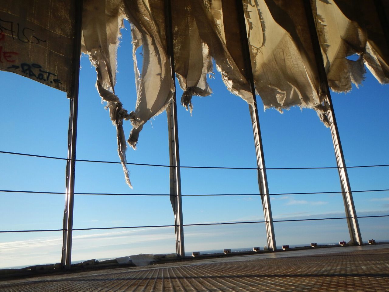 LOW ANGLE VIEW OF BUILT STRUCTURES AGAINST BLUE SKY