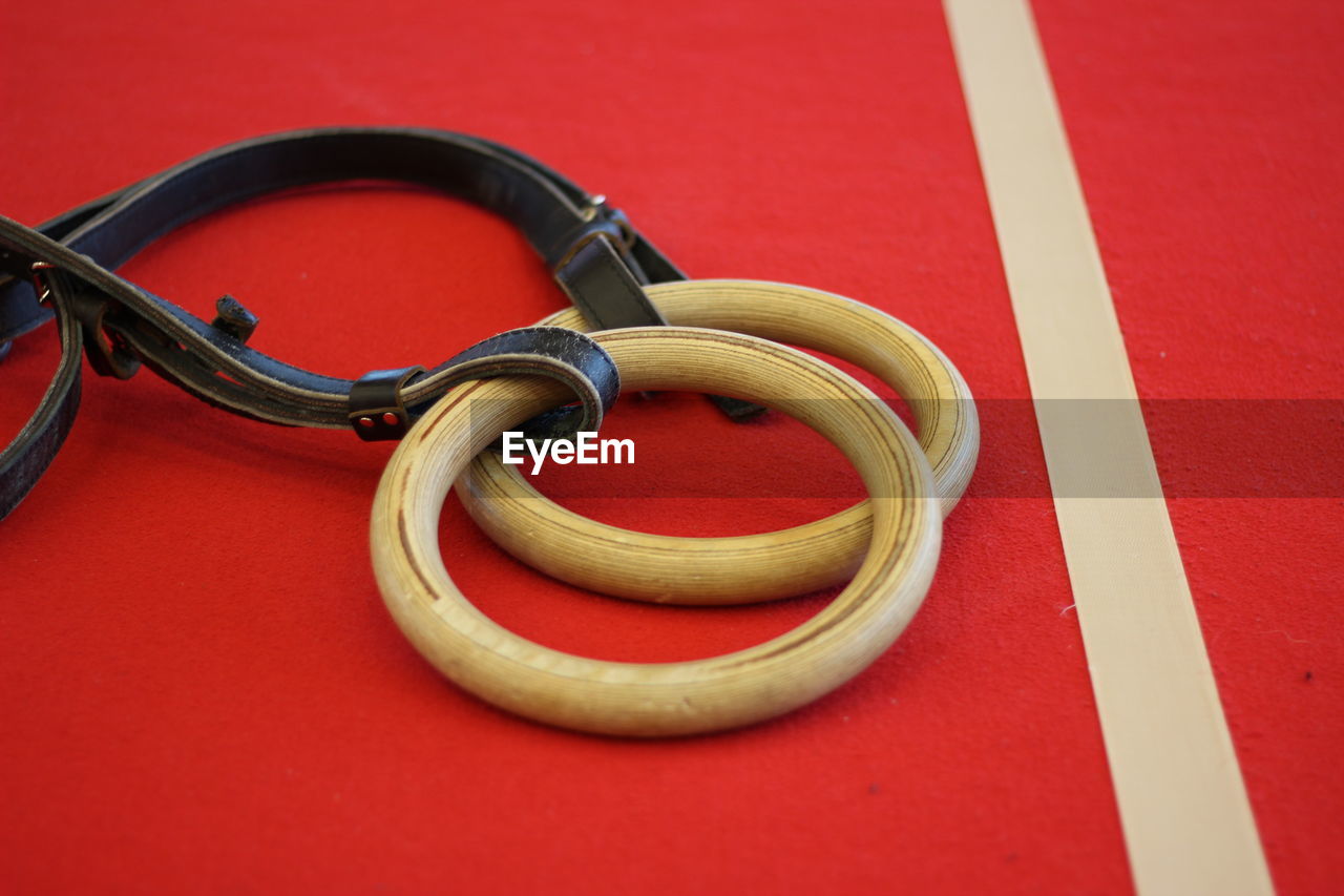 Close-up of gymnastic rings on floor