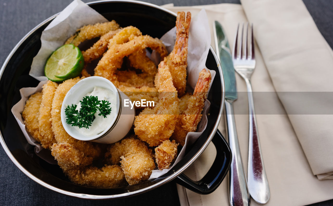 High angle view of fried prawns in bowl on table