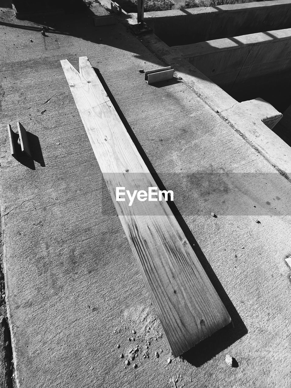 black, white, black and white, monochrome, monochrome photography, high angle view, day, sunlight, asphalt, roof, no people, wing, shadow, nature, outdoors, wood, road surface, transportation, road