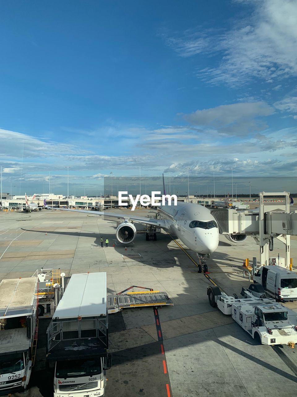 AIRPLANE ON RUNWAY AGAINST SKY