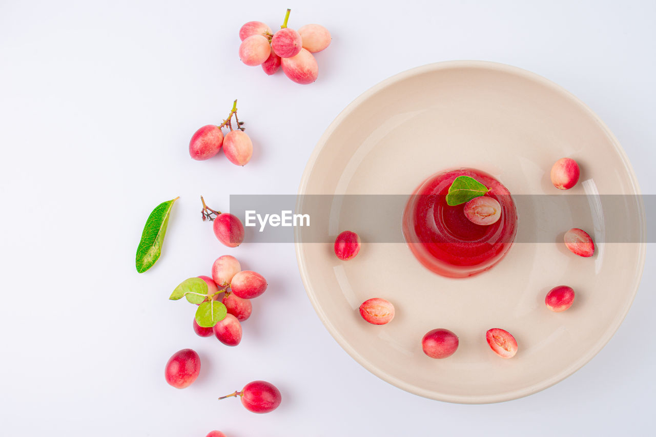 food and drink, food, fruit, healthy eating, freshness, red, wellbeing, studio shot, berry, vegetable, no people, petal, indoors, sweet food, cherry, tomato, nature, dessert, sweet, plant, still life, directly above, produce, strawberry, high angle view, heart, plate, pink, cherry tomato, organic, multi colored