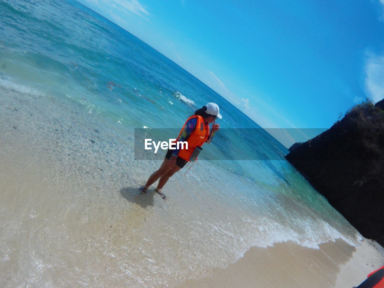 MAN SURFING IN SEA