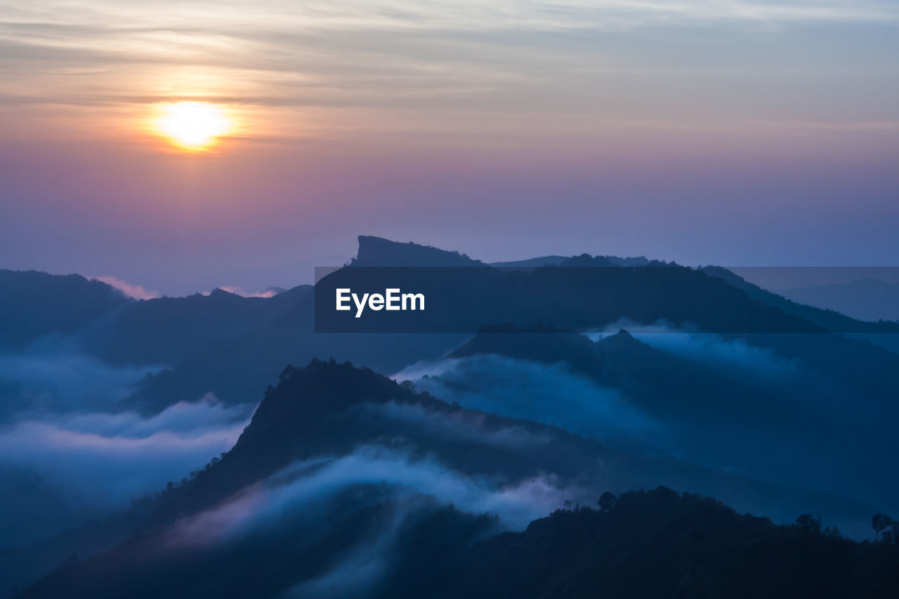 Scenic view of mountains against sky during sunset
