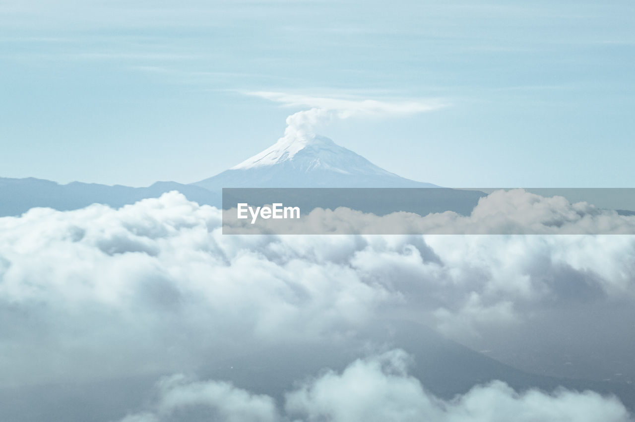 Majestic view of clouds covering snowcapped mountain