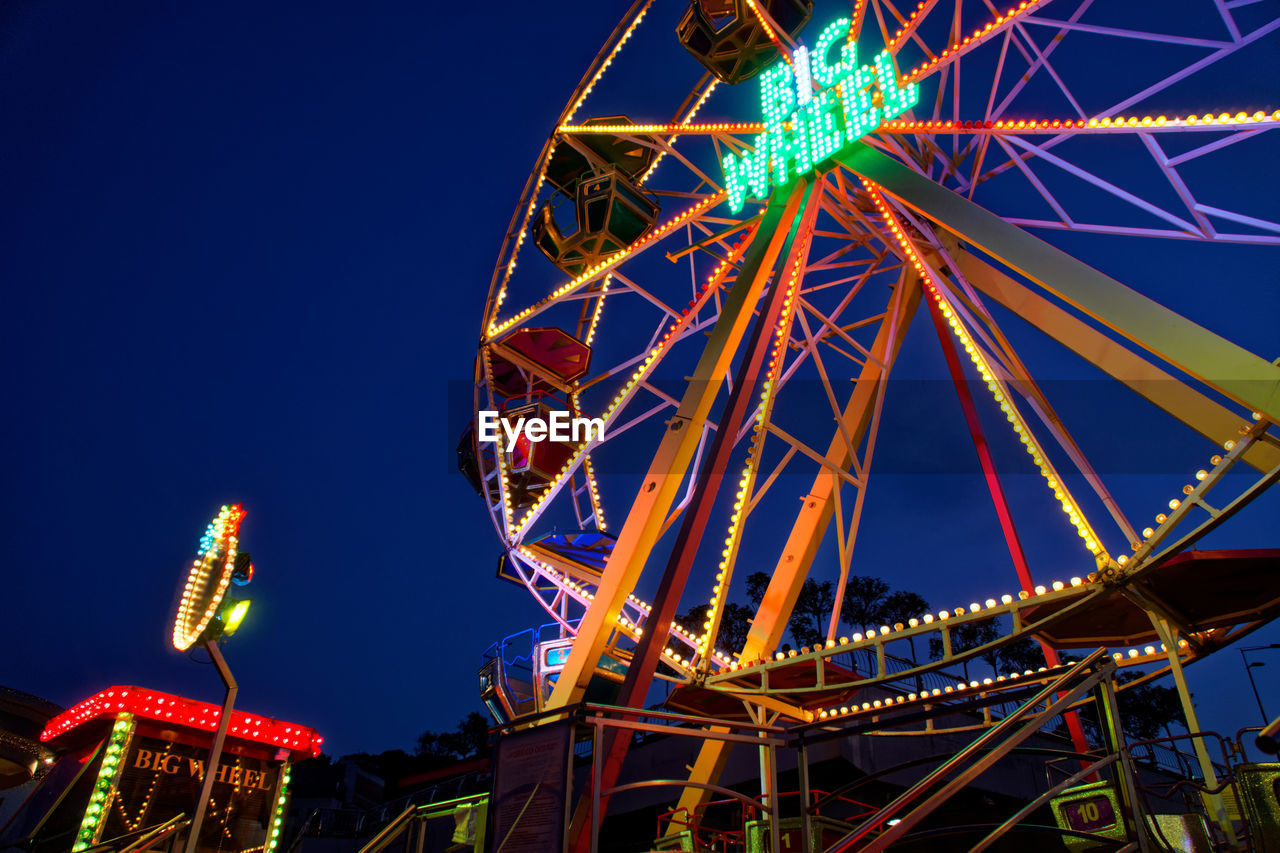 LOW ANGLE VIEW OF FERRIS WHEEL AGAINST SKY