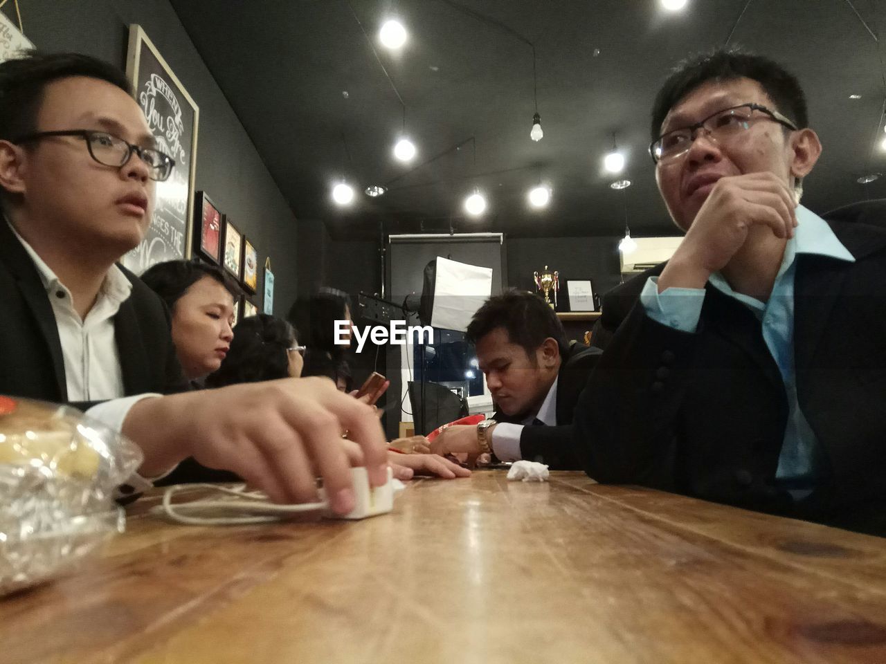 Business people sitting at table in cafe