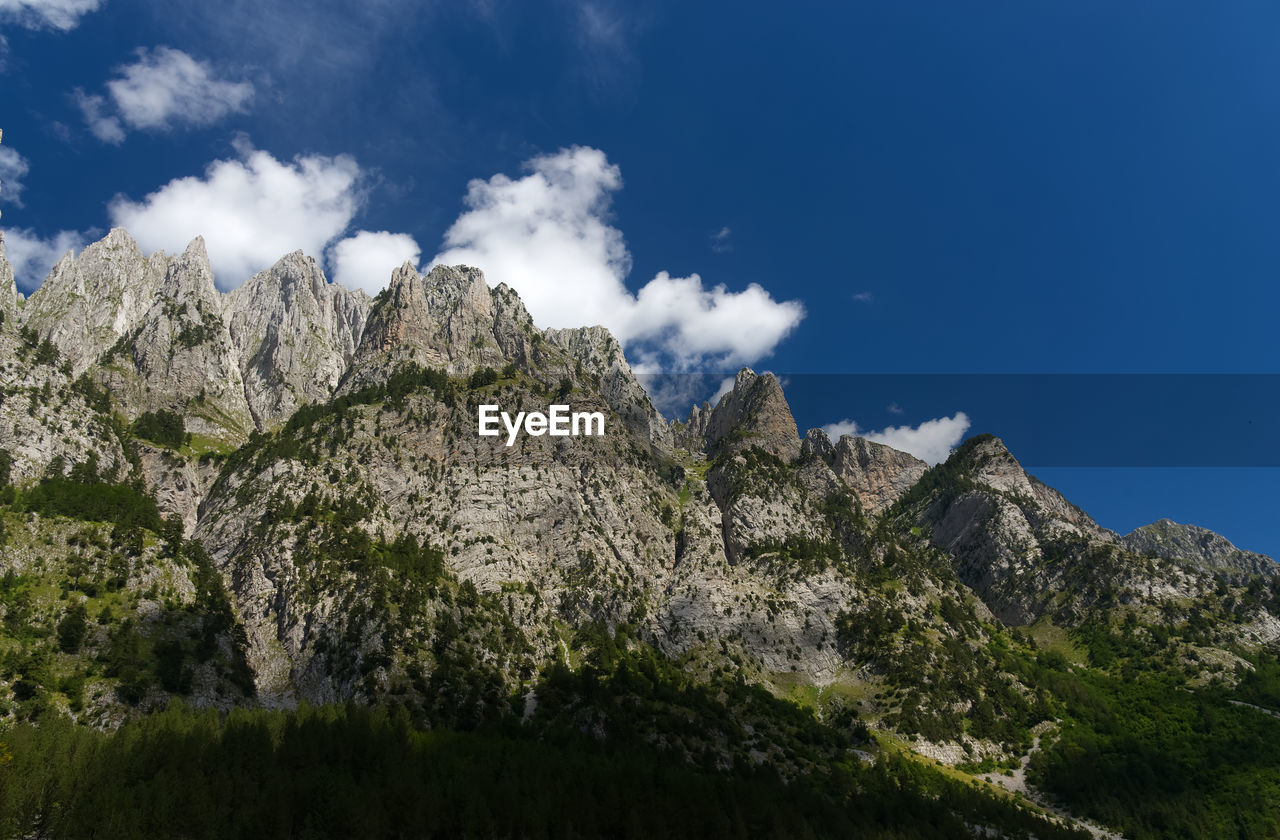 Low angle view of rocks against sky