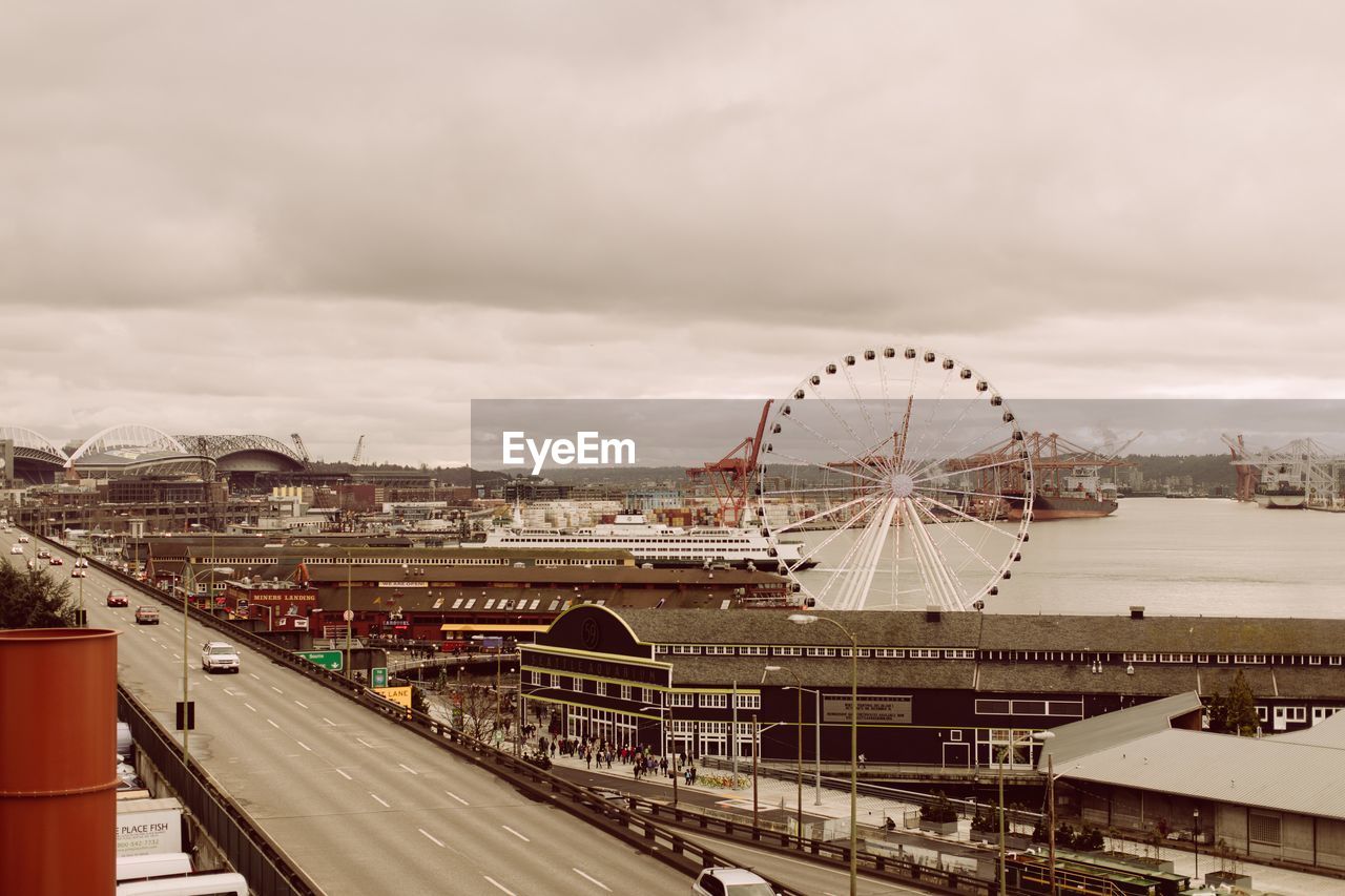 Ferris wheel in city against sky