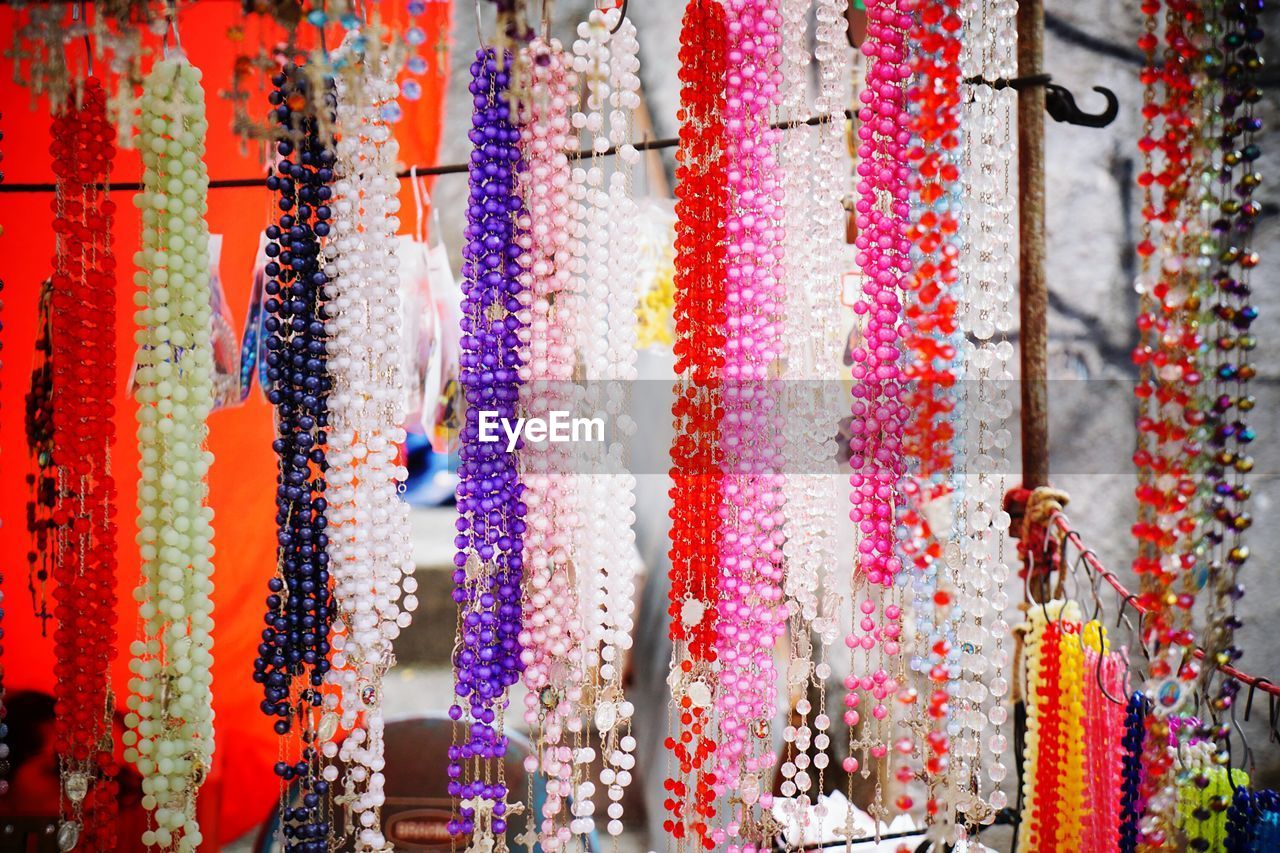 Close-up of colorful bead necklace for sale in market