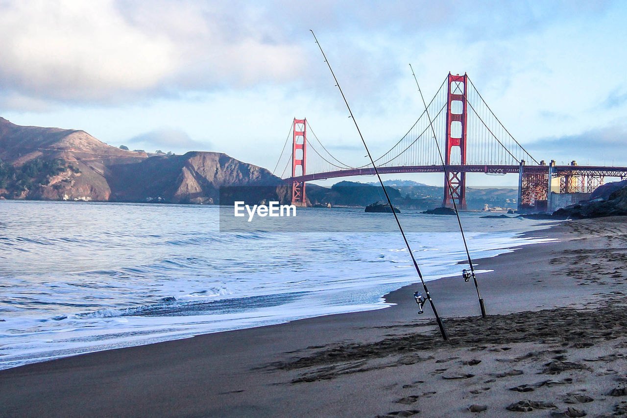 Golden gate bridge over sea against sky