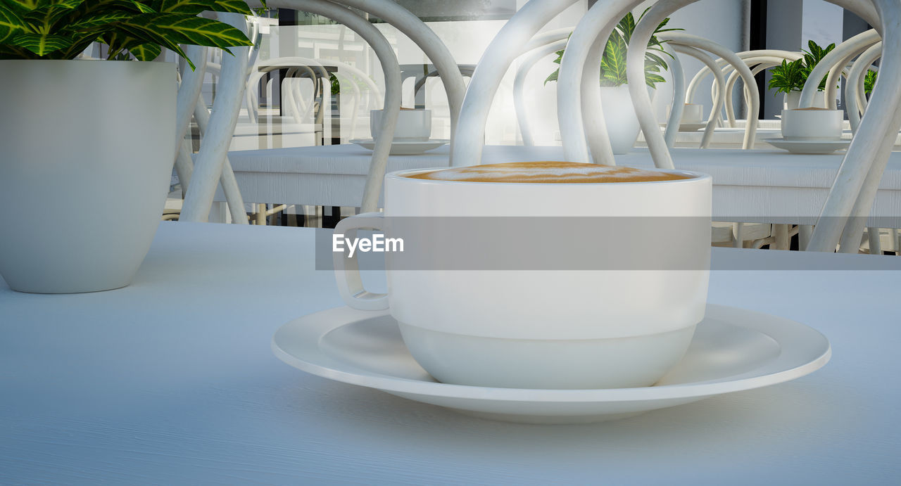 Close-up of coffee cup on table in restaurant