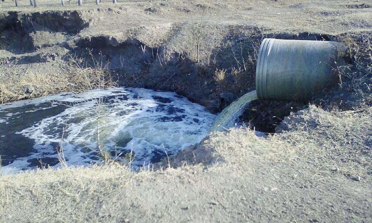 WATER FLOWING FROM BRIDGE