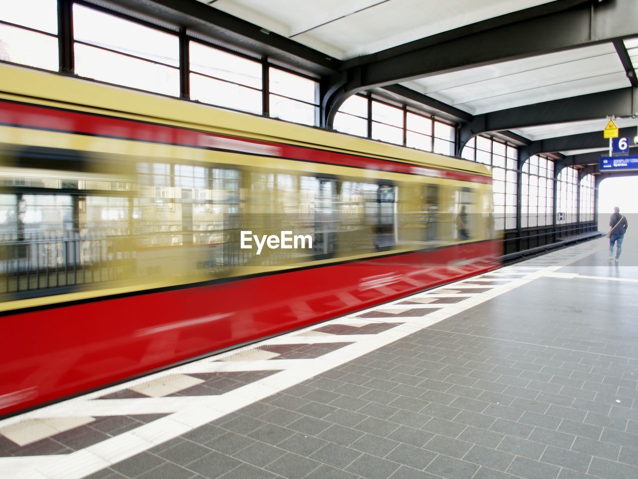 Blurred motion of train at railroad station