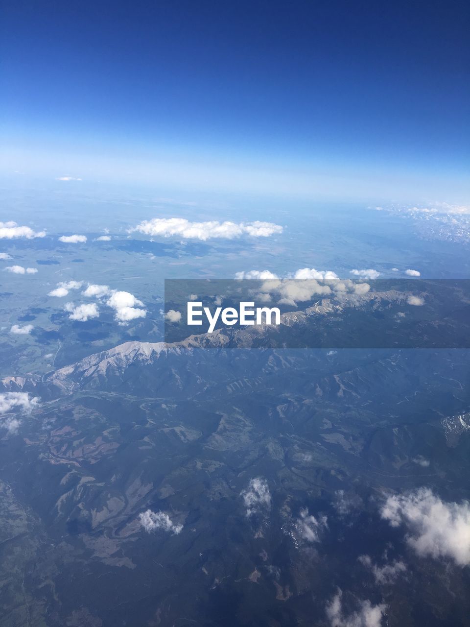 AERIAL VIEW OF CLOUDSCAPE OVER LANDSCAPE