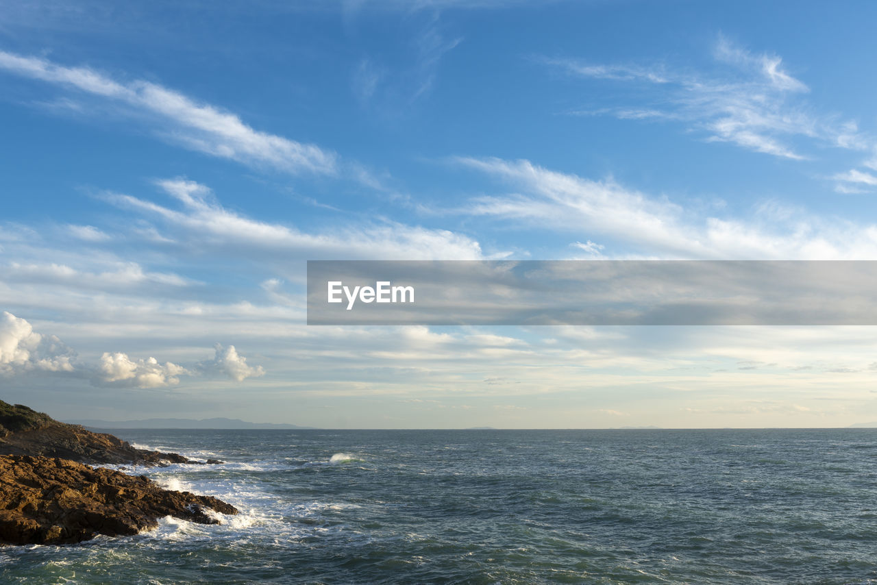 sea, water, sky, horizon, cloud, scenics - nature, ocean, beauty in nature, body of water, shore, horizon over water, coast, nature, land, wave, beach, tranquility, blue, seascape, tranquil scene, no people, environment, wind wave, outdoors, bay, idyllic, rock, day, travel, travel destinations, motion, coastline, landscape, non-urban scene