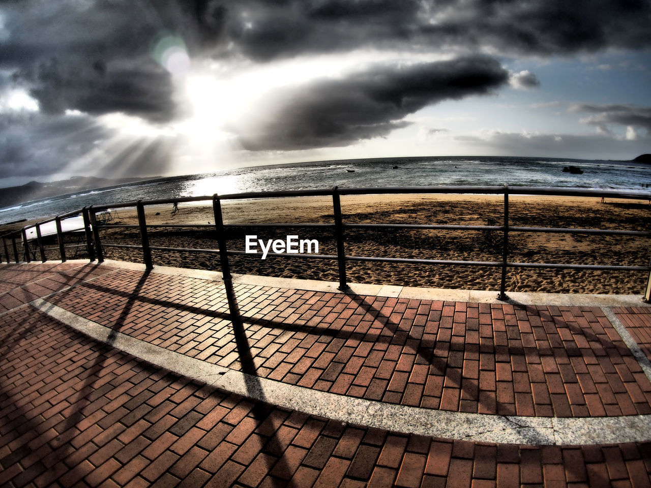 VIEW OF SEA AGAINST STORM CLOUDS