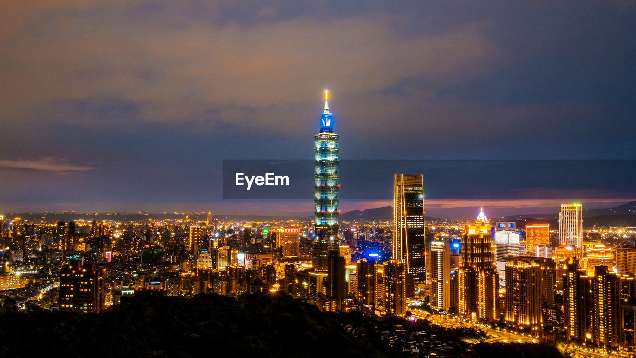 Illuminated buildings in city at night