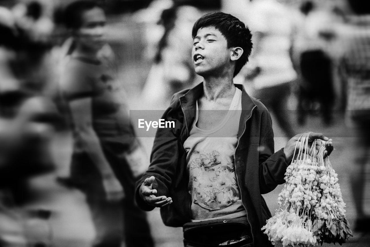 YOUNG MAN LOOKING AWAY