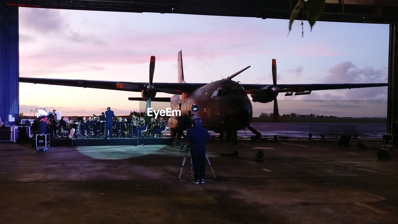 AIRPLANE ON RUNWAY AGAINST SKY