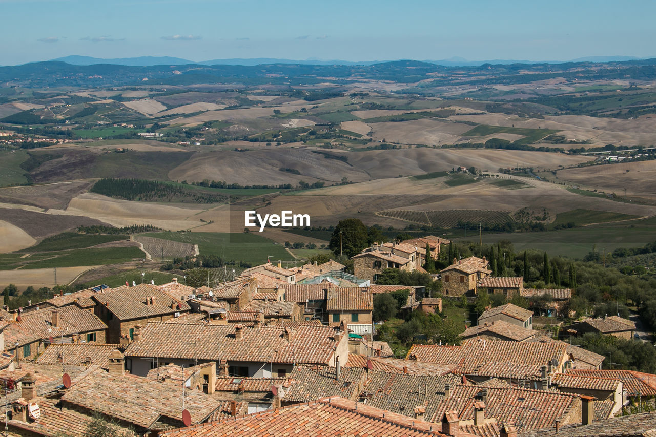 View of rooftops and hill of montalcino in tuscany, italy