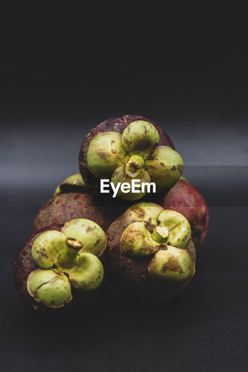 CLOSE-UP OF FRUITS ON TABLE