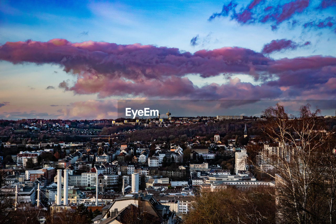 High angle shot of townscape against sky at sunset