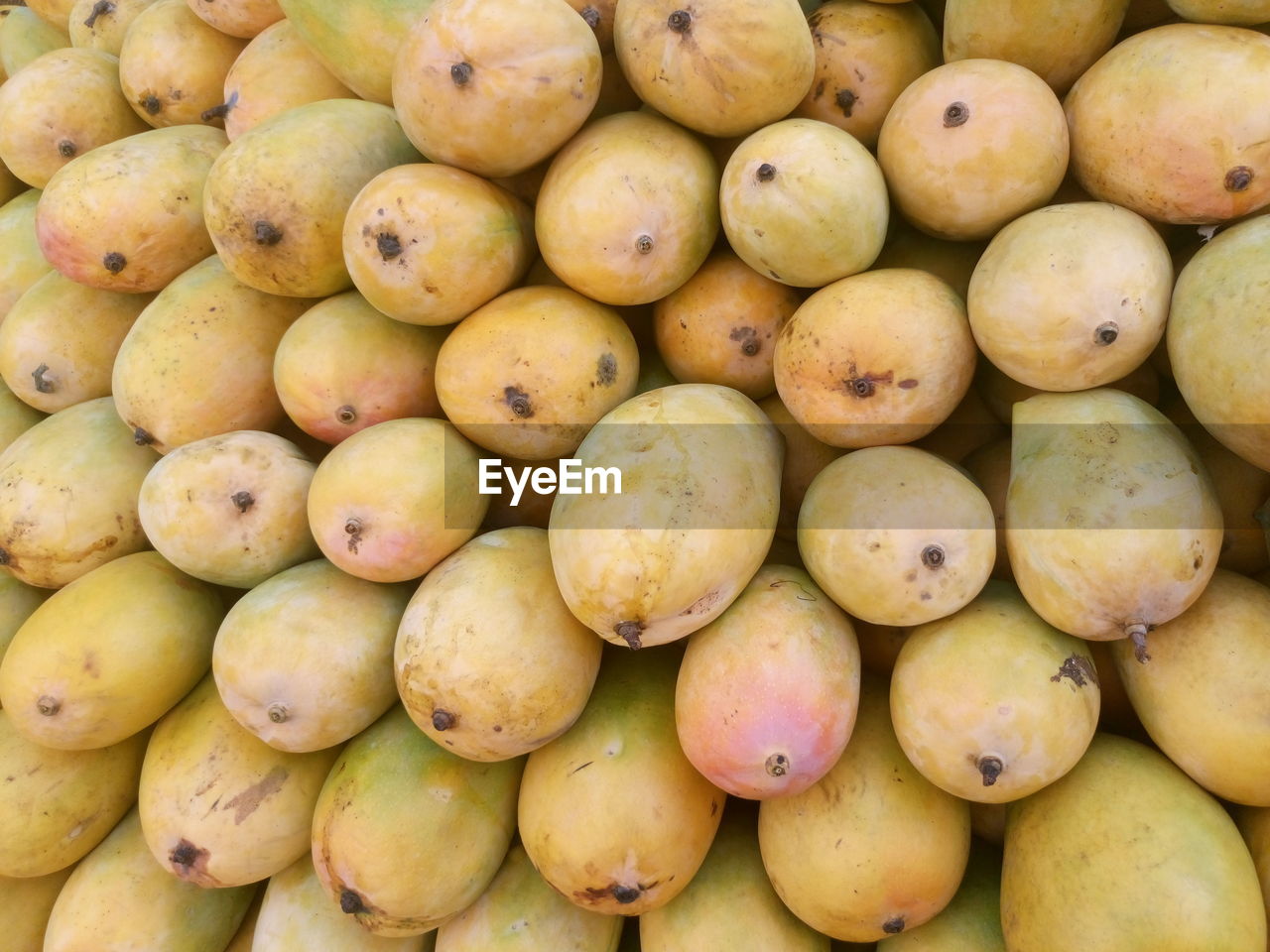 Full frame shot of mangoes for sale at market