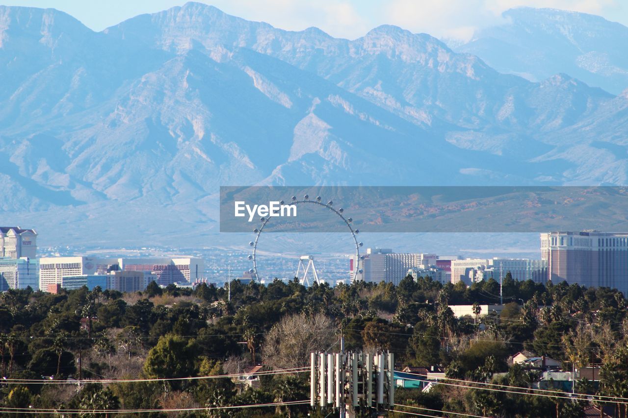 High angle view of town with mountains in background