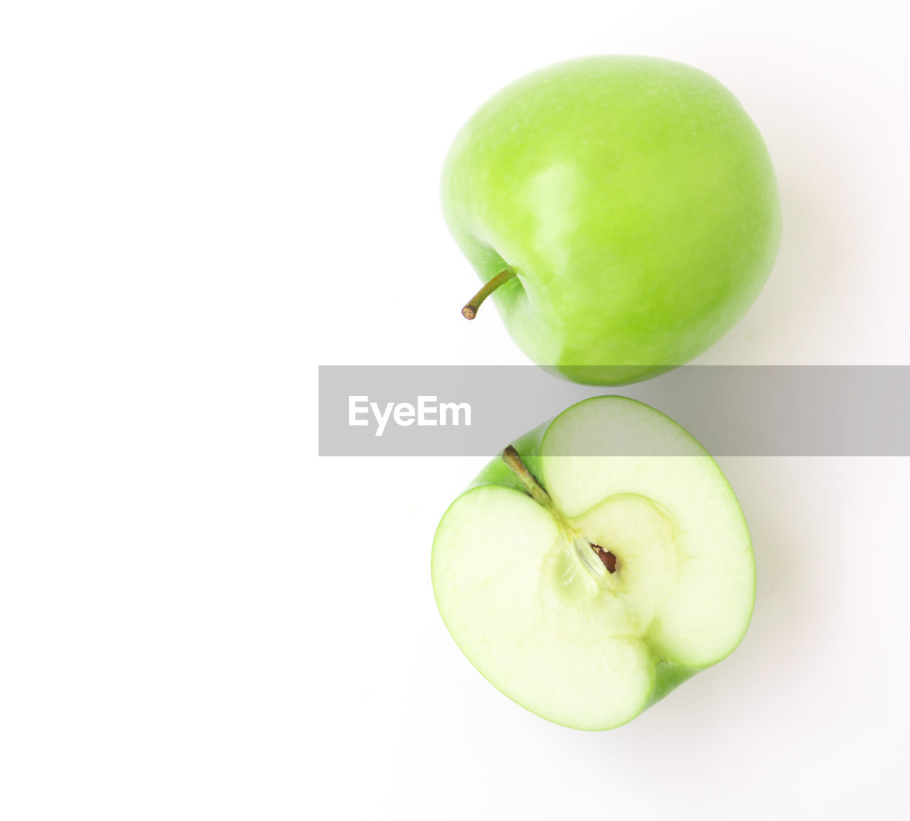 Directly above shot of granny smith apples over white background