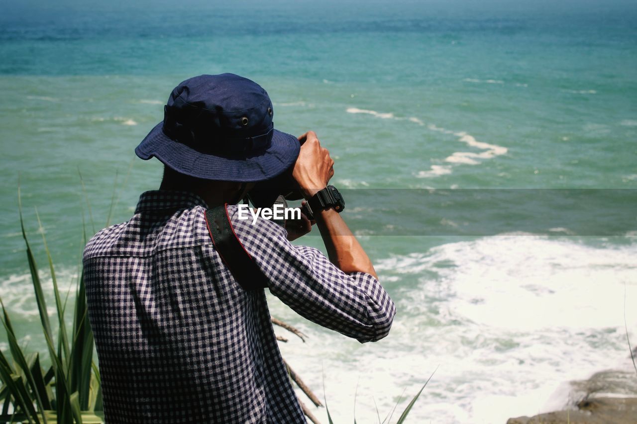 Man photographing sea