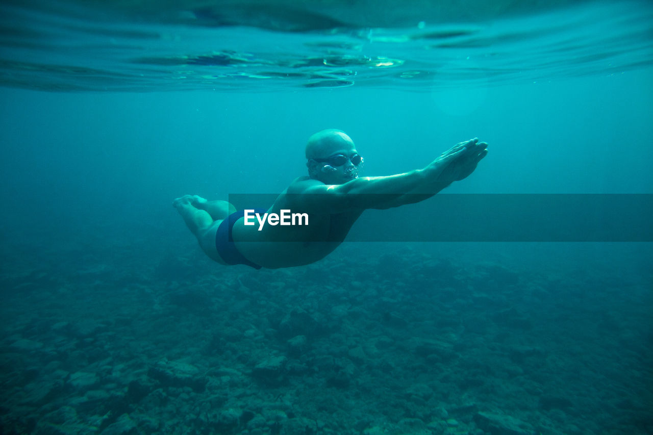 Man swimming in sea