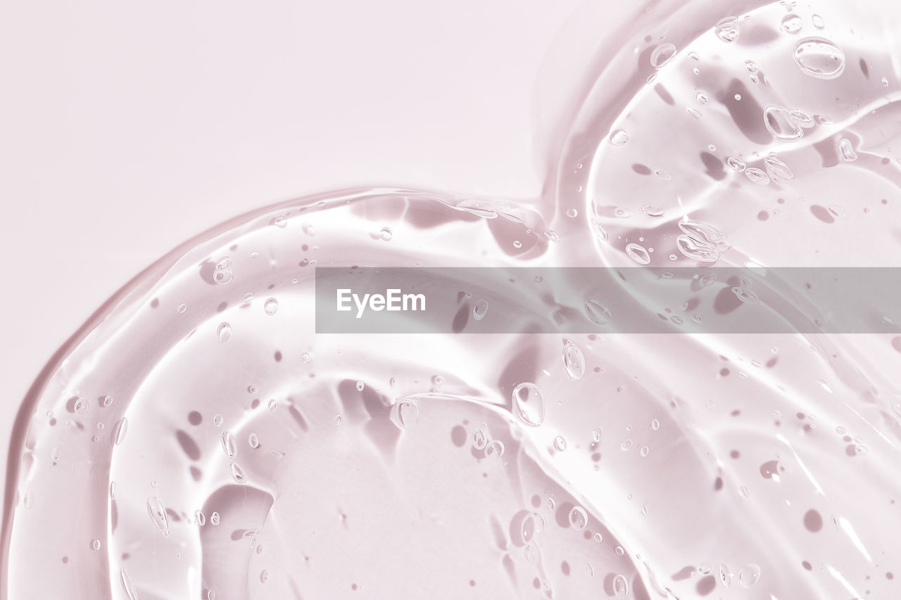 water, pink, indoors, food and drink, drink, refreshment, drop, no people, studio shot, close-up, bubble, petal, milk, freshness, splashing, motion, white background, food