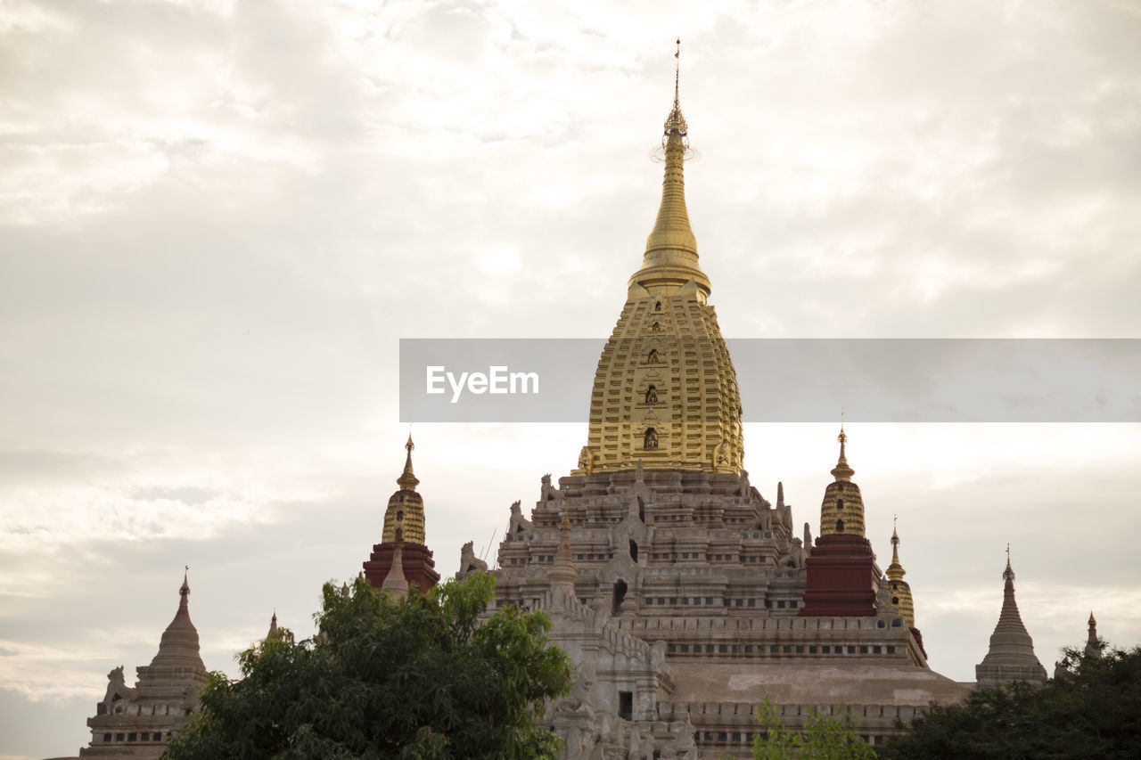 Golden tower of the ananda temple in old bagan, during golden sunset