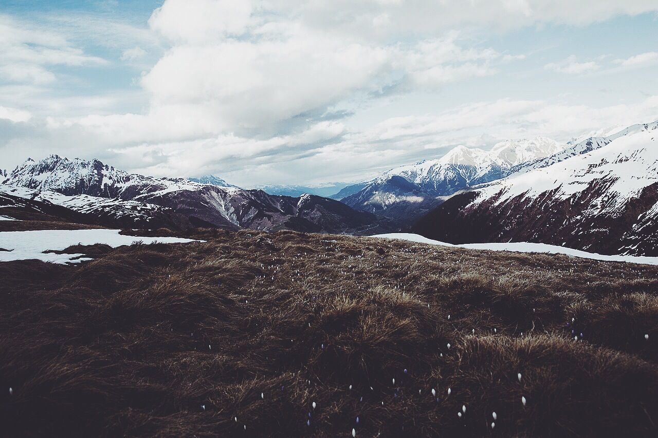 Scenic view of snow mountains against sky