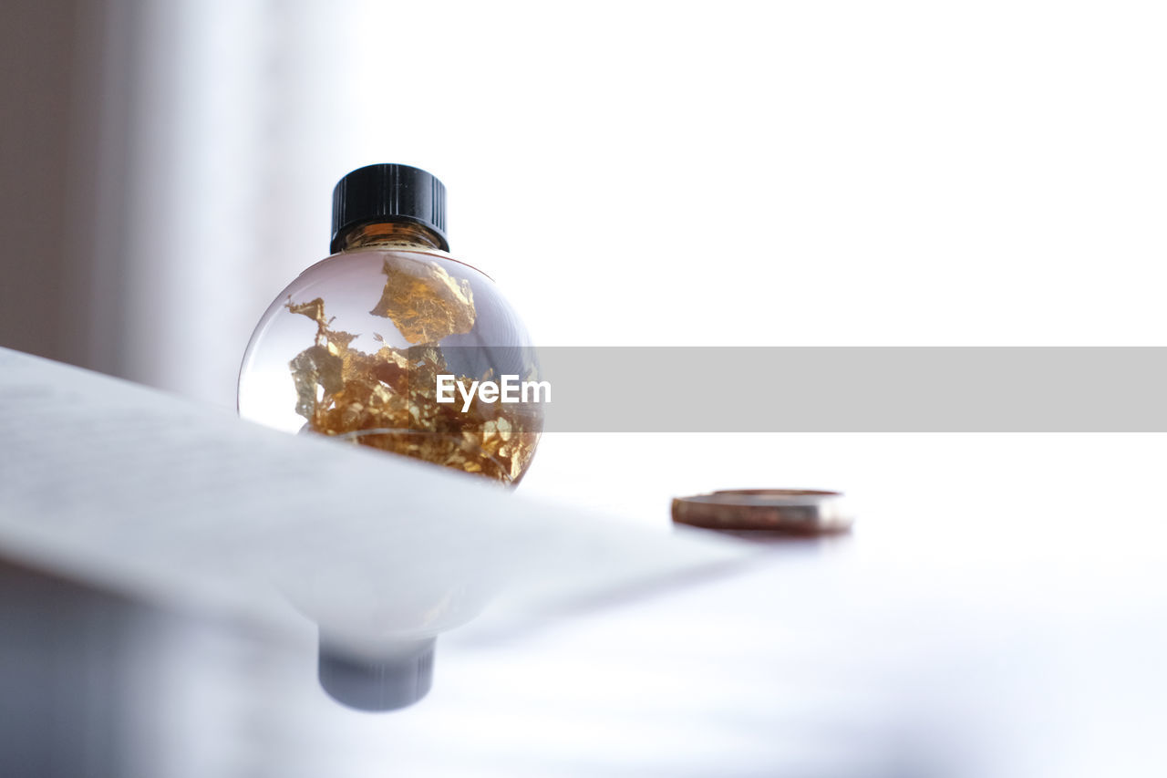 Close-up of glass bottle on table