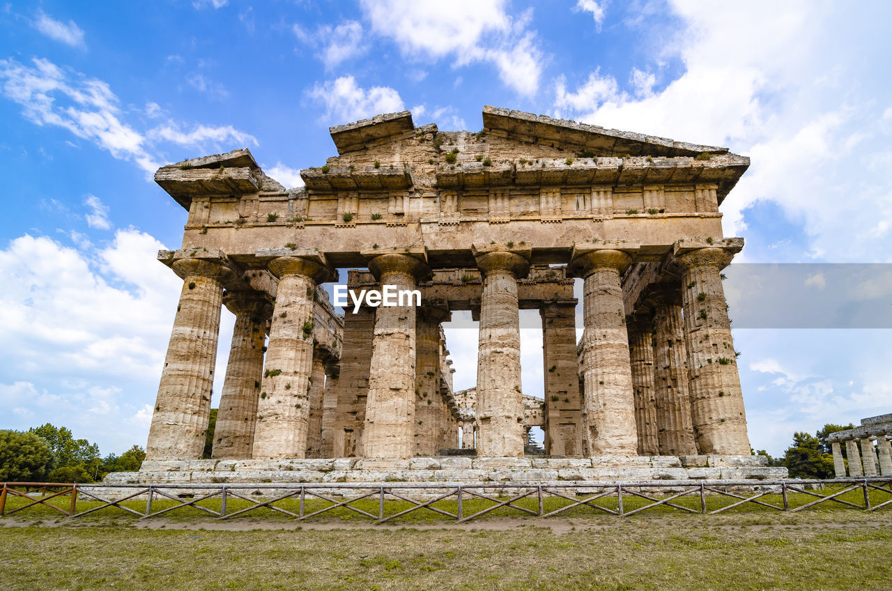 Front view of historical building against clear blue sky  , temple of paestum. italy