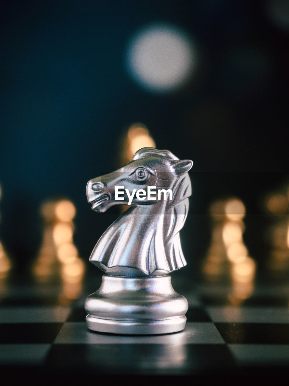 Close-up of chess pieces against black background