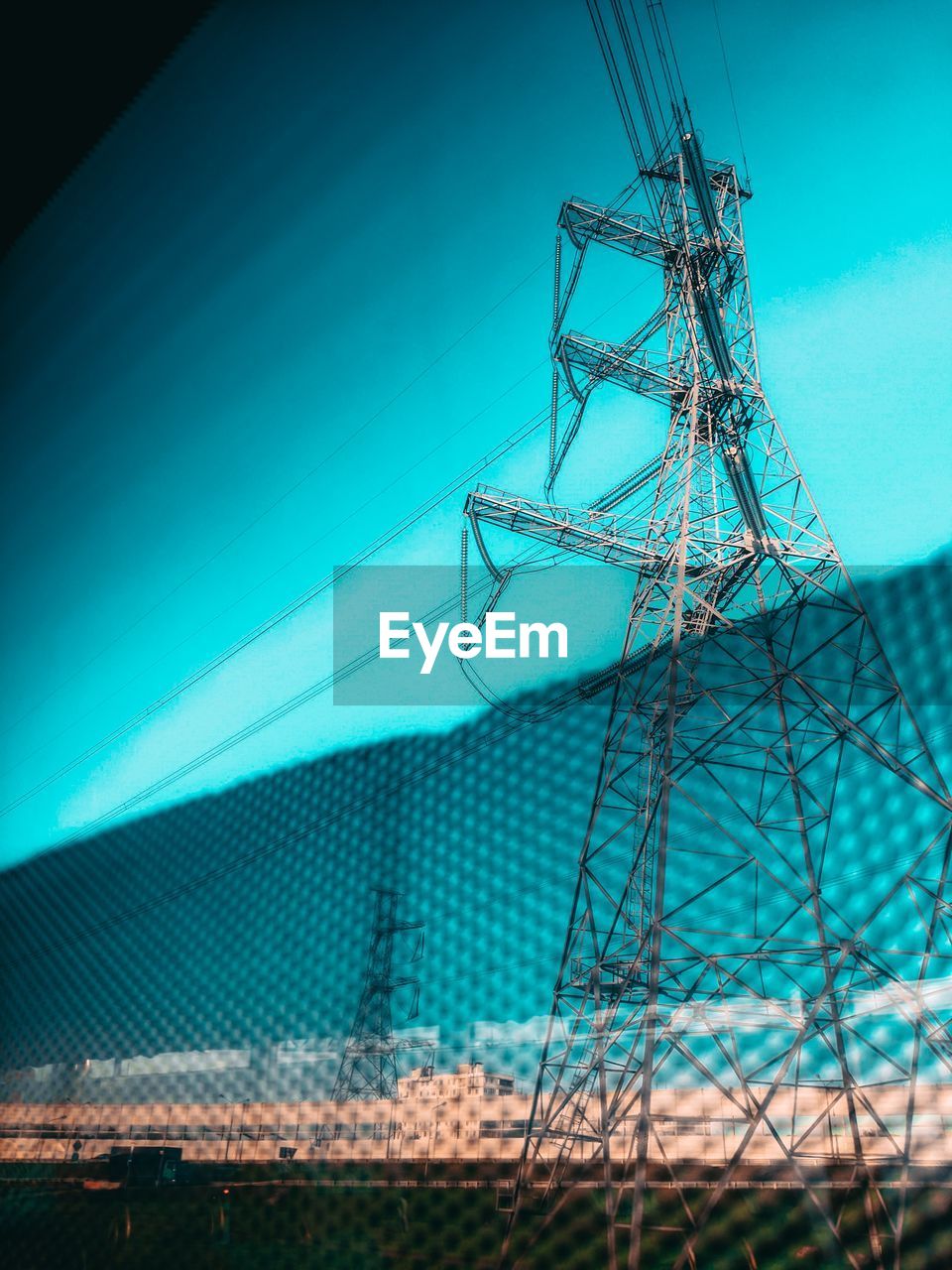 LOW ANGLE VIEW OF ELECTRICITY PYLON